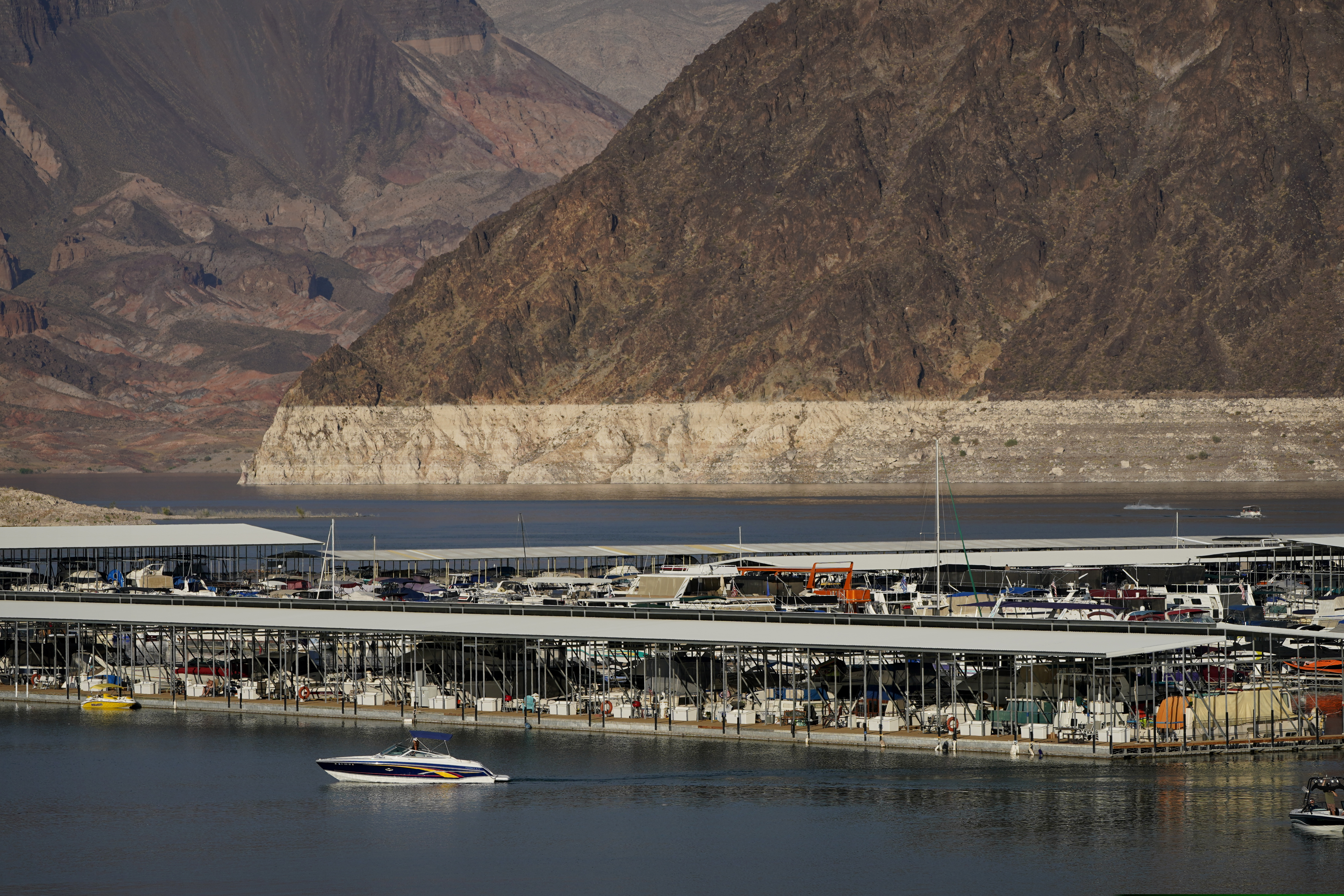 (John Locher | AP) A bathtub ring of light minerals delineates the high water mark on Lake Mead at the Lake Mead National Recreation Area, Thursday, Aug. 13, 2020, near Boulder City, Nev. The U.S. Bureau of Reclamation is expected to release projections that suggest the levels in Lake Powell and Lake Mead dipped slightly compared with last year.