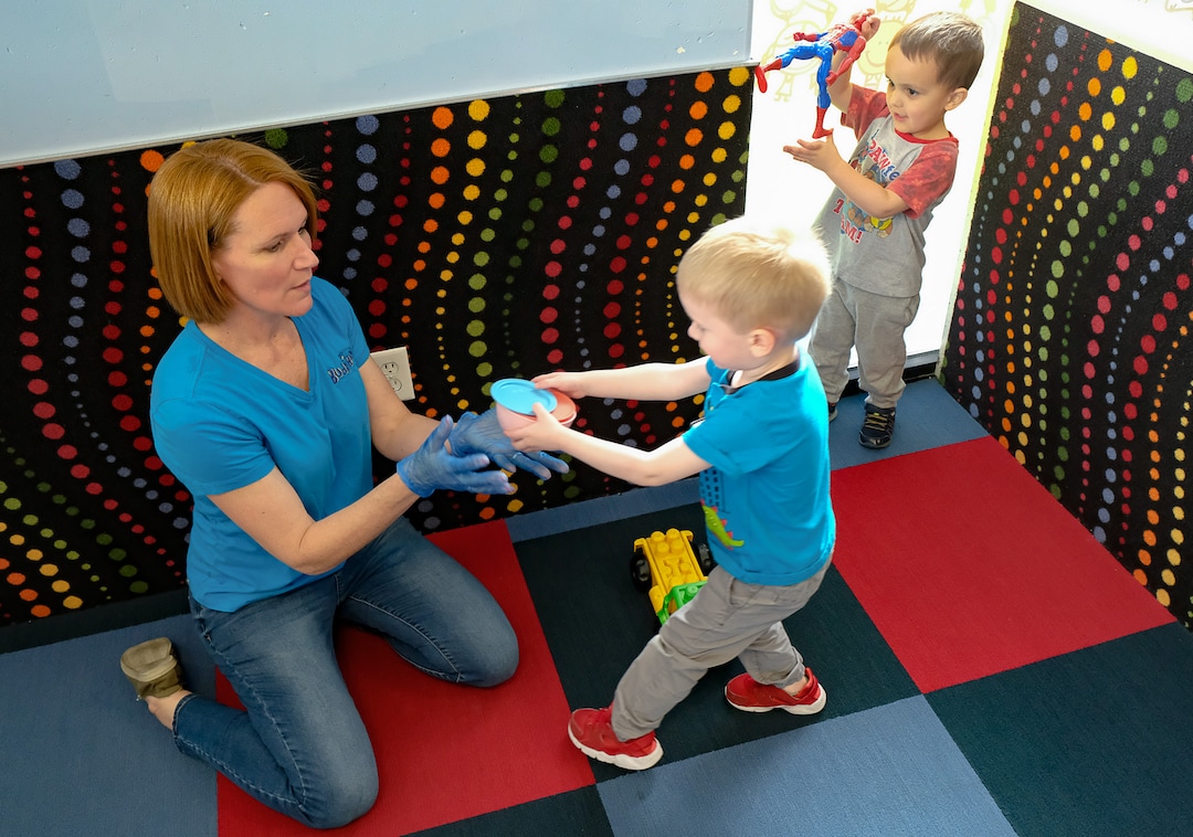 (Francisco Kjolseth  |  The Salt Lake Tribune) Monica Miles, director of The Buddy Bin child care business in North Salt Lake, plays pretend food making on Thursday, March 26, 2020. Miles has experienced a dramatic drop in the number of kids coming to her center, but she hopes to help families who are first responders and essential workers.