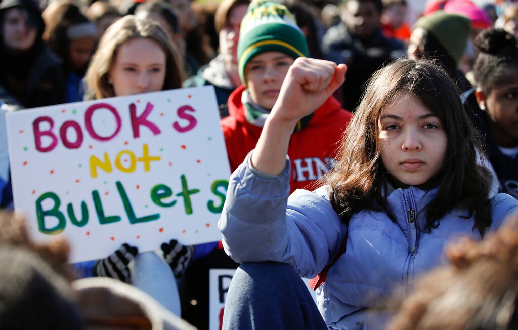 FILE- This March 14, 2018 file photo shows Students sitting in silence as they rally in front of the White House in Washington. Students walked out of school to protest gun violence in the biggest demonstration yet of the student activism that has emerged in response to last month's massacre of 17 people at Florida's Marjory Stoneman Douglas High School. In the wake of a Valentine's Day shooting, a handful of Parkland, Fla., teenagers are on the cusp of pulling off what could be one of the largest marches in history with nearly 1 million expected in DC and more than 800 sister marches planned across every continent. (AP Photo/Carolyn Kaster, File)