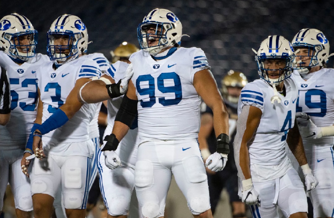BYU's Zac Dawe (99) reacts after making a play during the first half of an NCAA college football game against Navy, Monday, Sept. 7, 2020, in Annapolis, Md. (AP Photo/Tommy Gilligan)