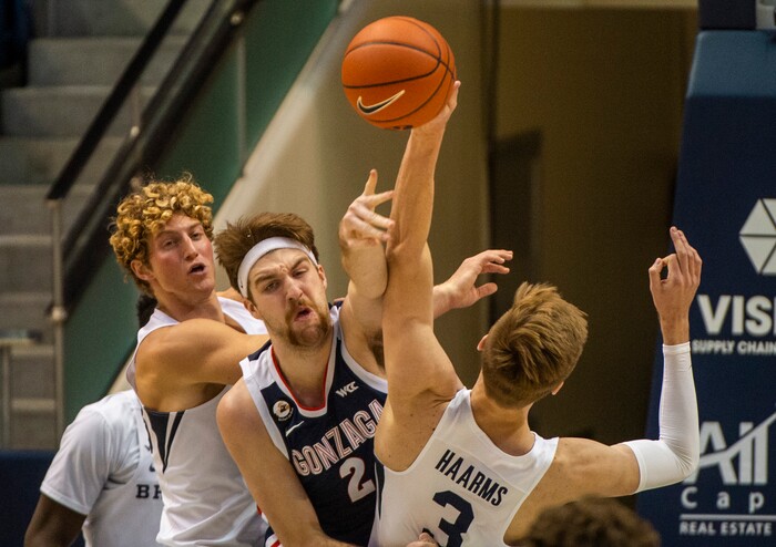 (Rick Egan | The Salt Lake Tribune)  Gonzaga Bulldogs guard Andrew Nembhard (3) goes for a rebound along with Brigham Young Cougars forward Matt Haarms (3), in West Coast Conference Basketball action between the Brigham Young Cougars and the Gonzaga Bulldogs at the Marriott Center in Provo, on Monday, Feb. 8, 2021.
