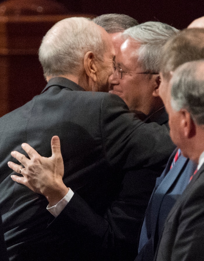 (Rick Egan  |  The Salt Lake Tribune)         President Russell M. Nelson hugs new Apostle, Gerrit W. Gong, after the Saturday morning session of the188th Annual General Conference in Salt Lake City,  Saturday, March 31, 2018.