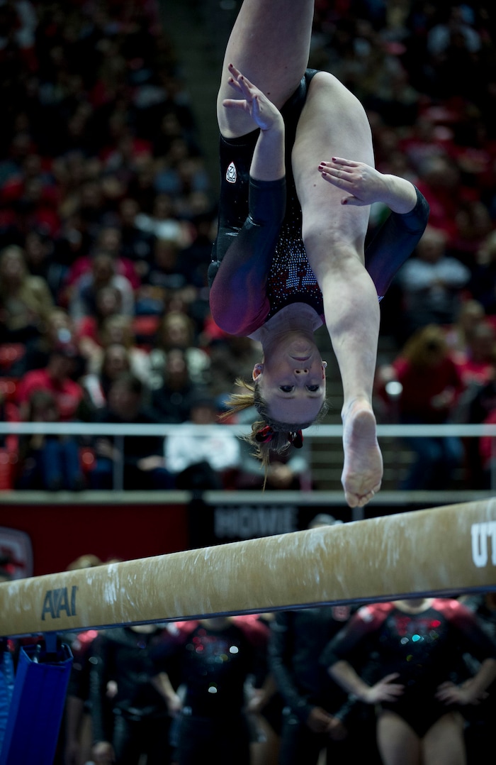Lennie Mahler  |  The Salt Lake TribuneMaddy Stover performs a 9.700 routine on the bars in a super meet at the Huntsman Center on Friday, Jan. 16, 2015.