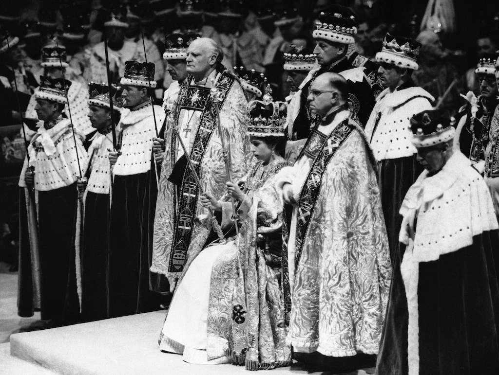 (AP) Britain's Queen Elizabeth II sits on a throne, during her coronation, in London, June 2, 1953.