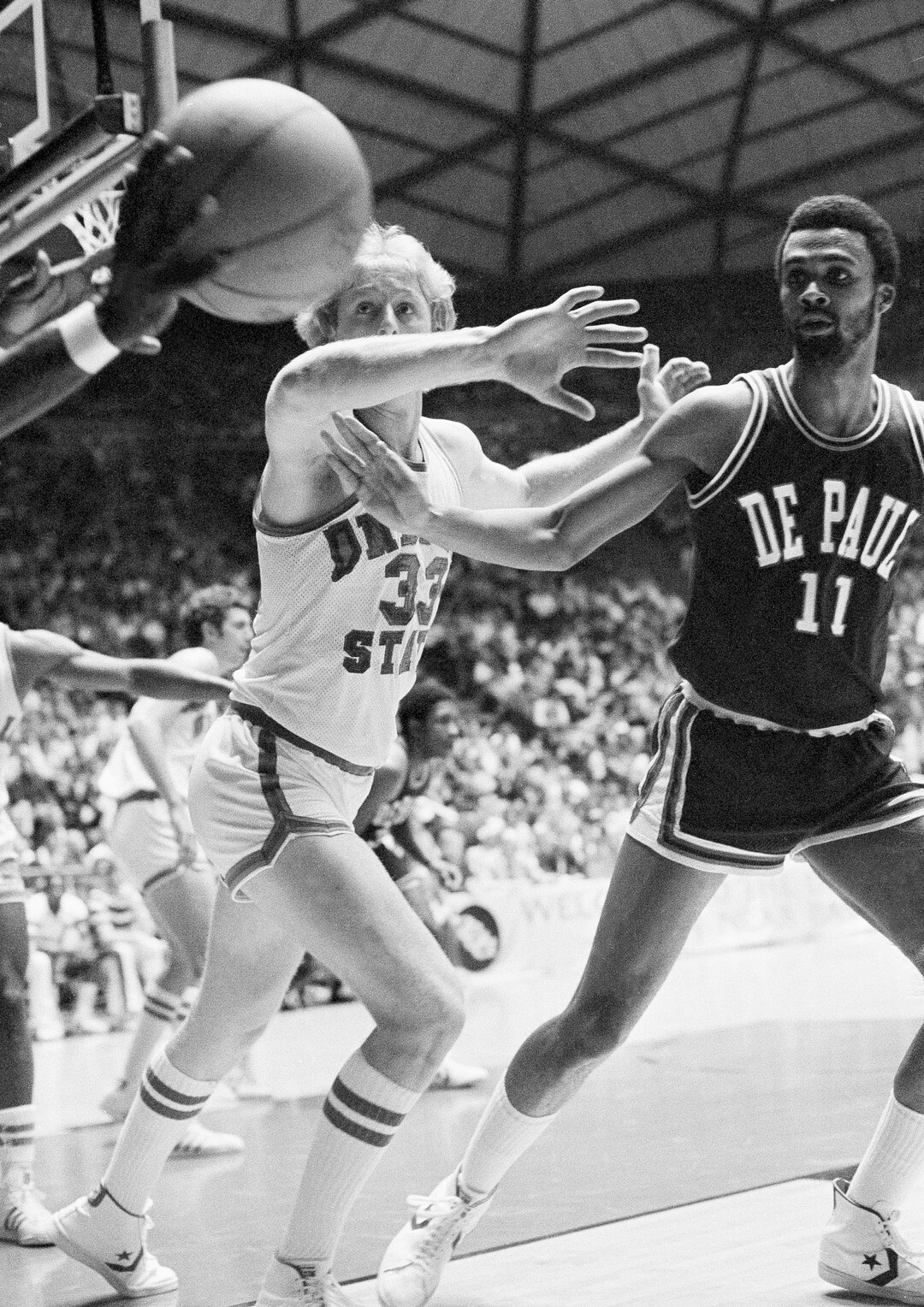 (AP Photo) Indiana State University's Larry Bird (33) is shown working defense against DePaul Saturday, March 26, 1979 in Salt Lake City, Utah during ISU's semi-final game in the NCAA Basketball Championships. DePaul player at right is James Mitchem (11).