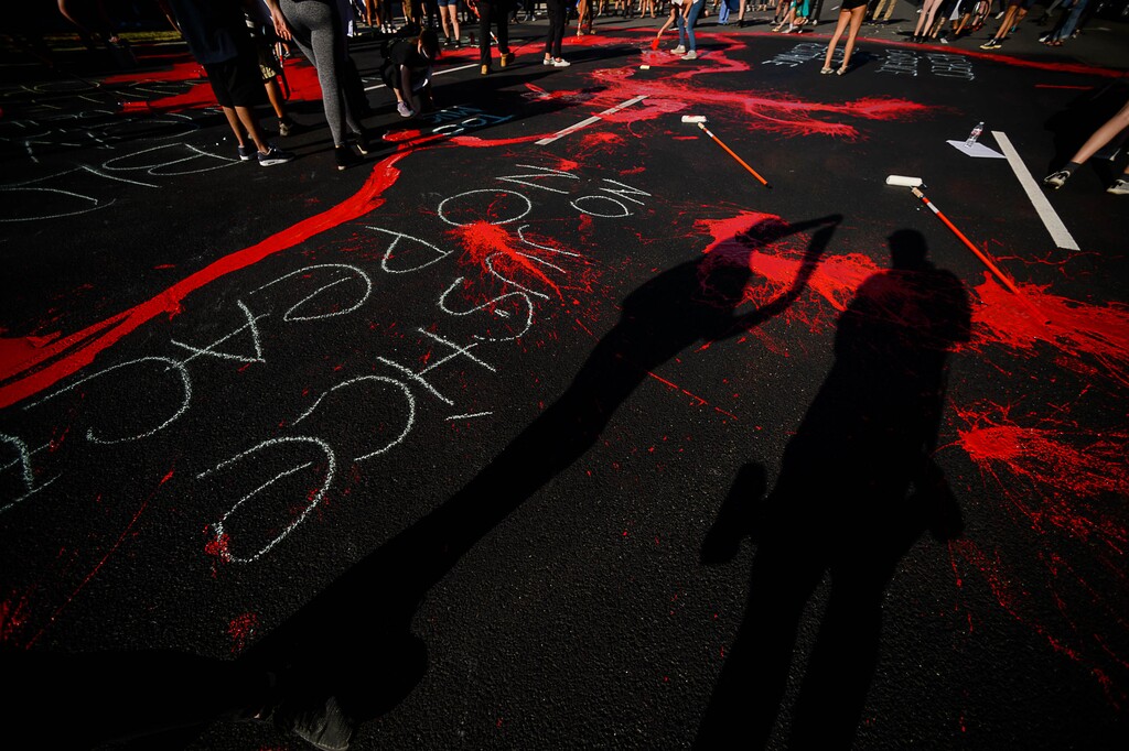 (Trent Nelson  |  Tribune file photo) Protesters paint the street red in front of the Salt Lake County District Attorney’s office in Salt Lake City on Thursday, July 9, 2020.