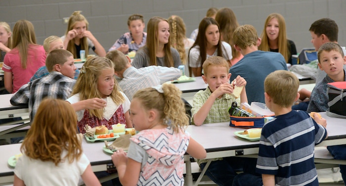 (Al Hartmann | The Salt Lake Tribune) The entire student body - all 38 students at full strength -- ate lunch alongside staff at Park Valley School. Kids sat at tables to converse with students their own ages, ranging from 5 and 15.