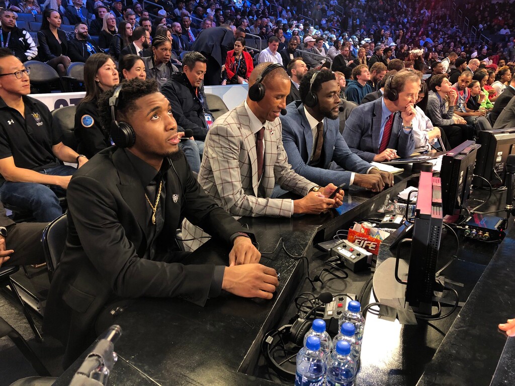 (Photo by NBAE, courtesy of the Utah Jazz) Donovan Mitchell commentates the 2019 All-Star Saturday Slam Dunk Contest next to TNT's Reggie Miller, Chris Webber, and Kevin Harlan.