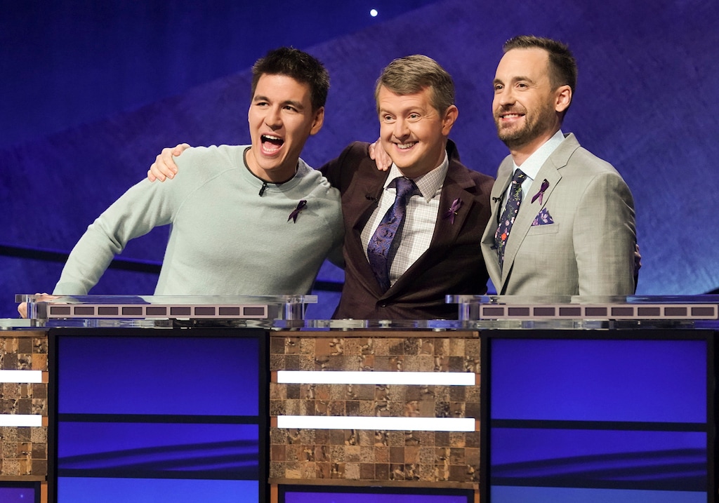 (Eric McCandless | ABC via AP) Contestants James Holzhauer, left, Ken Jennings and Brad Rutter appear on the set of "Jeopardy! The Greatest of All Time" in Los Angeles.
