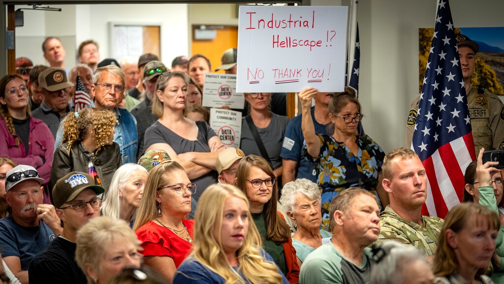 (Rick Egan | The Salt Lake Tribune) People fill Rocky Ridge Town Hall as Taylor Flake, whose home sits across from the site of a proposed data center campus near Mona, speaks in opposition to the project during a Juab County Commission meeting on Tuesday, Sept. 8, 2026.