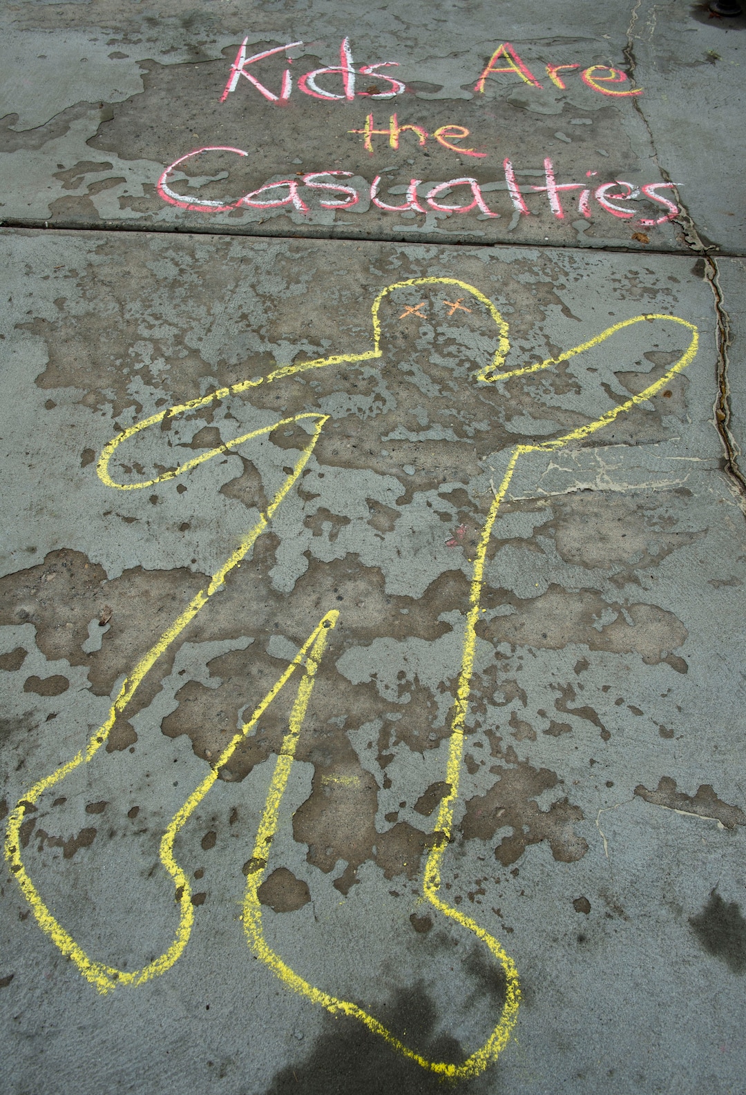 (Rick Egan  |  The Salt Lake Tribune)   William Hoffert 8, draws on the side walk in front of the Lehi City Hall, to protest the expansion of Geneva Rock's mining activities near their neighborhood, Tuesday, April 2, 2019.