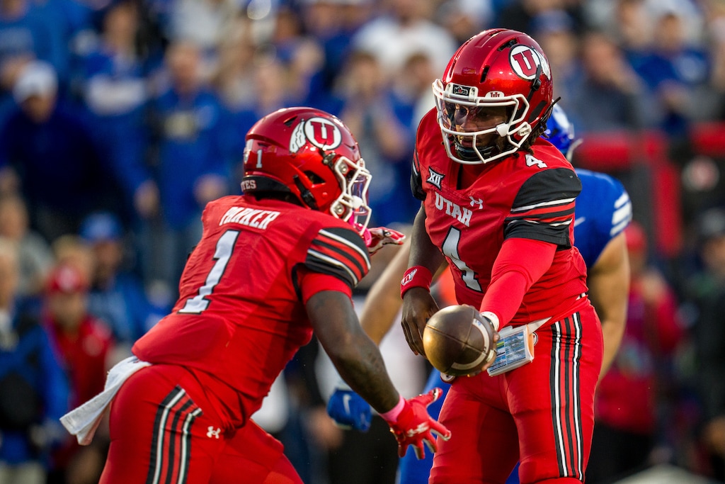 (Trent Nelson  |  The Salt Lake Tribune) Utah Utes quarterback Devon Dampier (4) and Utah Utes running back Wayshawn Parker (1) as BYU hosts Utah, NCAA football at LaVell Edwards Stadium in Provo on Saturday, Oct. 18, 2025.