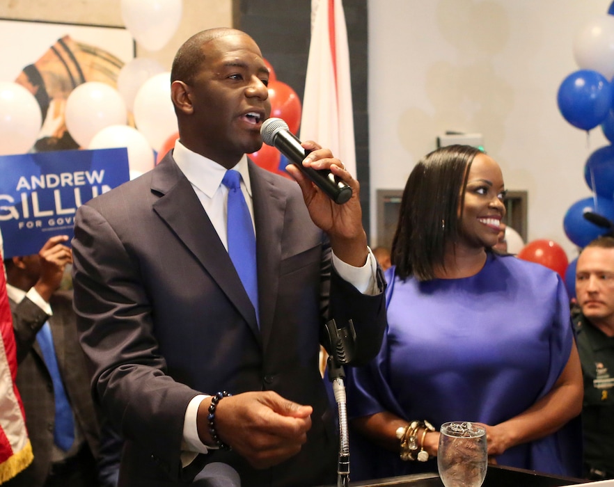Andrew Gillum and his wife, R. Jai Gillum addresses his supporters after Andrew Gillum won the Democratic primary for governor on Tuesday, Aug. 28, 2018, in Tallahassee, Fla. Gillum defeated former U.S. Rep. Gwen Graham, the daughter of former U.S. Sen. Bob Graham and four other candidates. (AP Photo/Steve Cannon)