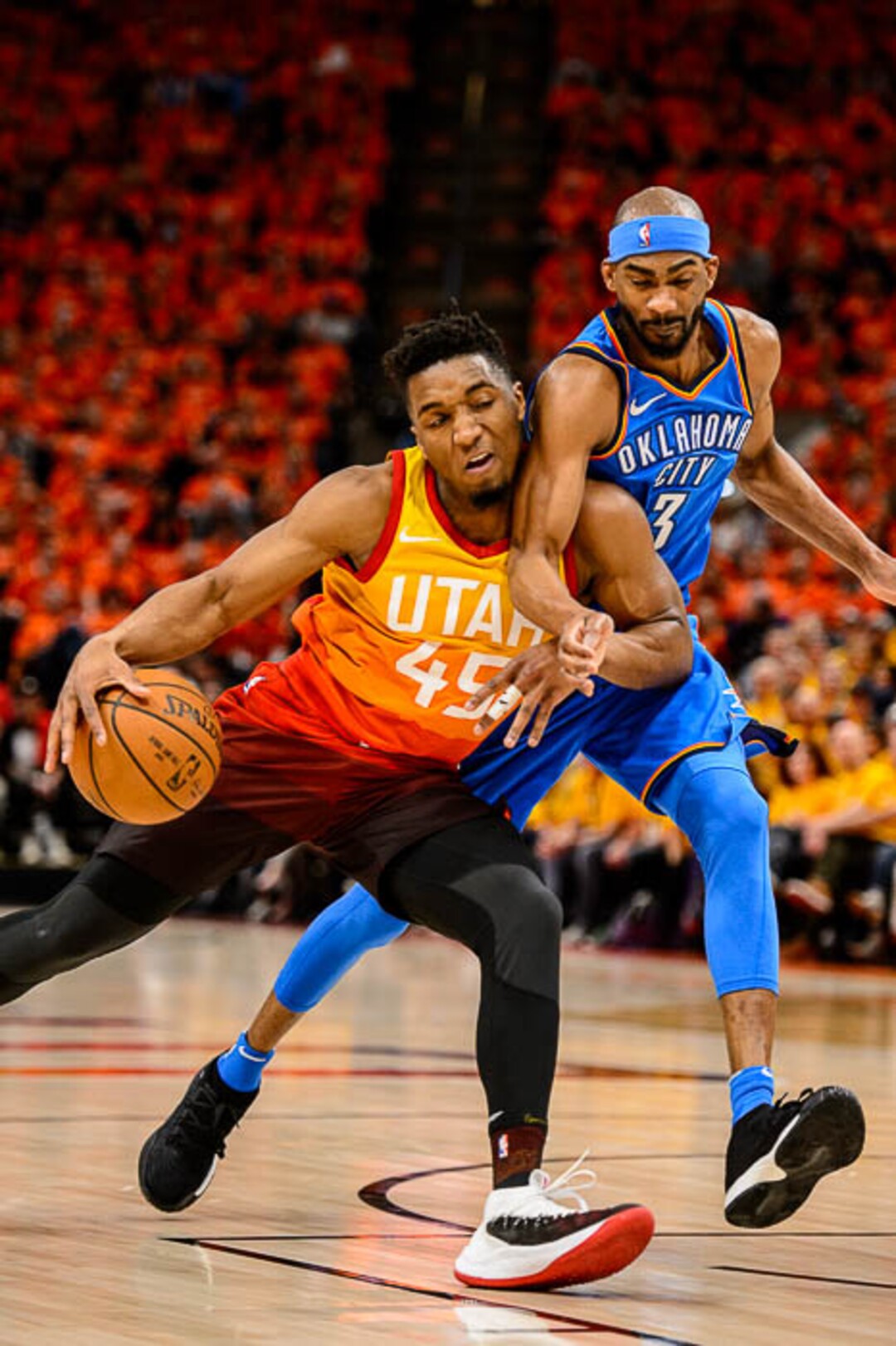 (Trent Nelson | The Salt Lake Tribune)  Utah Jazz host the Oklahoma City Thunder, Game 3, NBA playoff basketball in Salt Lake City, Saturday April 21, 2018. Utah Jazz guard Donovan Mitchell (45) collides with Oklahoma City Thunder forward Corey Brewer (3).