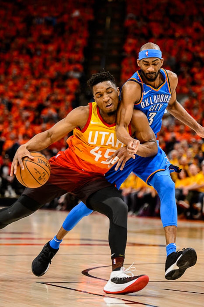 (Trent Nelson | The Salt Lake Tribune)  
Utah Jazz host the Oklahoma City Thunder, Game 3, NBA playoff basketball in Salt Lake City, Saturday April 21, 2018. Utah Jazz guard Donovan Mitchell (45) collides with Oklahoma City Thunder forward Corey Brewer (3).