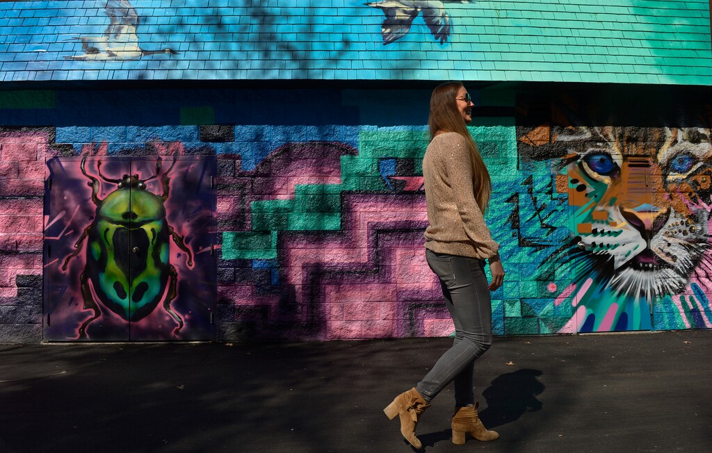 Leah Hogsten | The Salt Lake Tribune
l-r Third generation Lagoon owner Julie Freed walks past the new mural in the park's Kiddie Land section painted by muralist Benjamin Weimeyer.