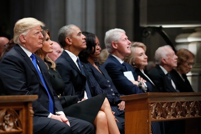 From left, President Donald Trump, first lady Melania Trump, former President Barack Obama, Michelle Obama, former President Bill Clinton, former Secretary of State Hillary Clinton, and former President Jimmy Carter listen as former President George W. Bush speaks during a State Funeral at the National Cathedral, Wednesday, Dec. 5, 2018, in Washington, for former President George H.W. Bush.(AP Photo/Alex Brandon, Pool)