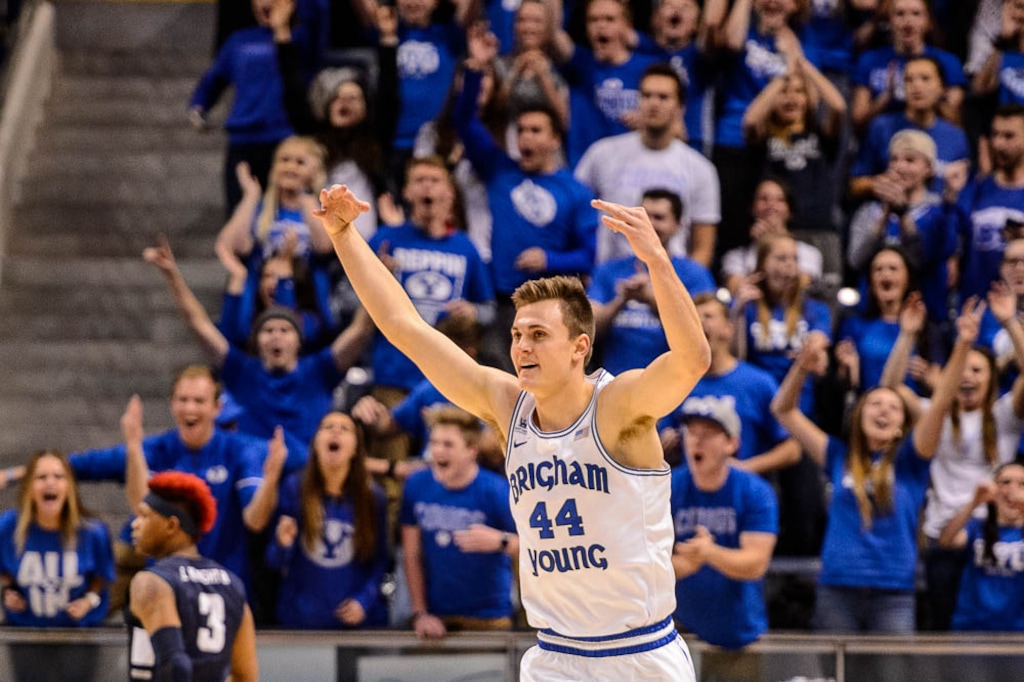 (Trent Nelson | The Salt Lake Tribune)  Brigham Young Cougars guard Connor Harding (44) celebrates a three-pointer as BYU hosts Utah State, NCAA basketball in Provo on Wednesday Dec. 5, 2018.