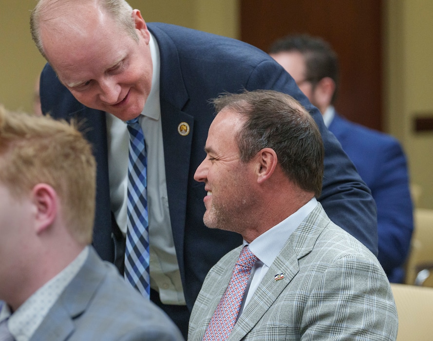 (Leah Hogsten | The Salt Lake Tribune) House Majority Leader Mike Schultz, R-Hooper, is greeted by Brian McKenzie, the Davis County Clerk, before Schultz prepares to present his first substitute HB269 before the House Government Operations Committee in the House Building, Jan. 31, 2023.