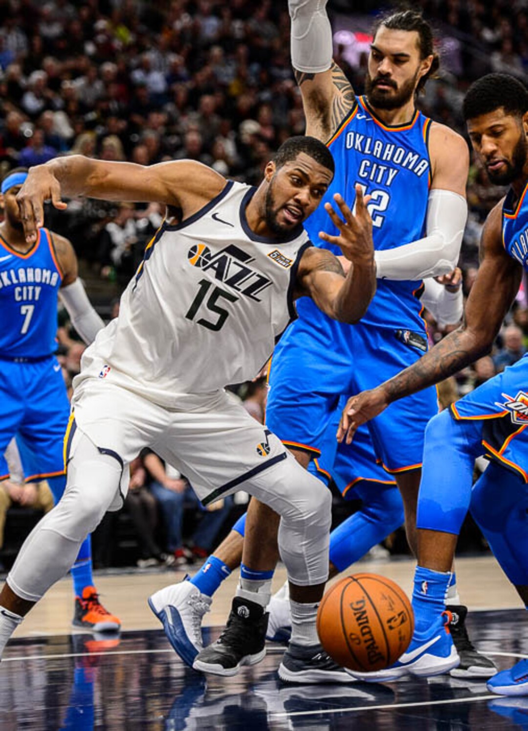 (Trent Nelson | The Salt Lake Tribune)  Utah Jazz forward Derrick Favors (15) is stripped of the ball as the Utah Jazz host the Oklahoma City Thunder, NBA basketball in Salt Lake City, Saturday December 23, 2017.