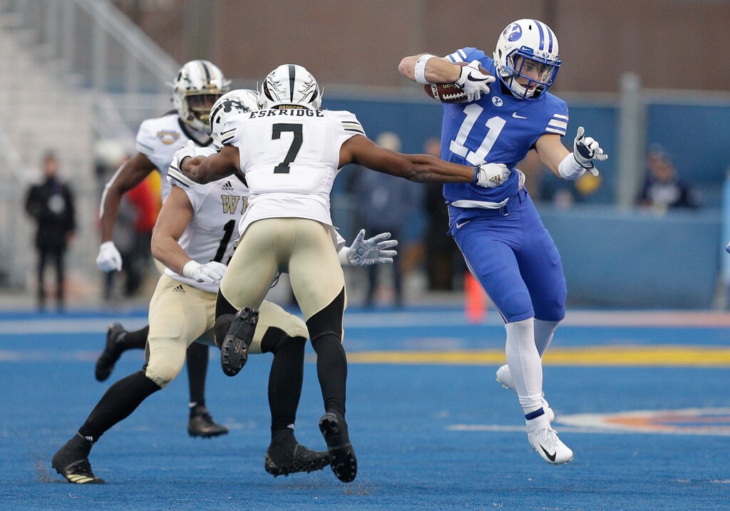 BYU defensive back Austin Lee (11) tries to get past Western Michigan linebacker Najee Clayton (7) during an interception return in the second half of the Famous Idaho Potato Bowl NCAA college football game, Friday, Dec. 21, 2018, in Boise, Idaho. (AP Photo/Steve Conner)