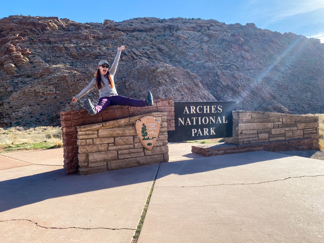 (Emily Pennington  |  Little A) Emily Pennington at the entrance to National Park. Pennington has written a memoir, "Feral," about her experience visiting all the national parks in the United States.