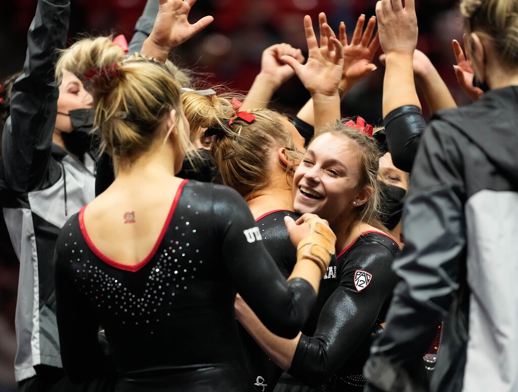 (Francisco Kjolseth | The Salt Lake Tribune) Utah’s Grace McCallum is celebrated by teammates following her floor routine during their gymnastics meet with Stanford at the Huntsman Center in Salt Lake City, Saturday, Jan. 29, 2022.