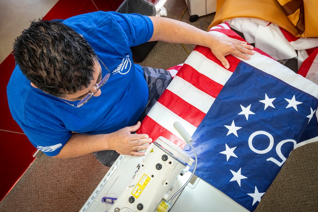 (Rick Egan | The Salt Lake Tribune) Gabriel Meneses makes one of the limited edition flags for the United States 250th anniversary at Colonial Flag in Sandy on Monday, June 1, 2026.
