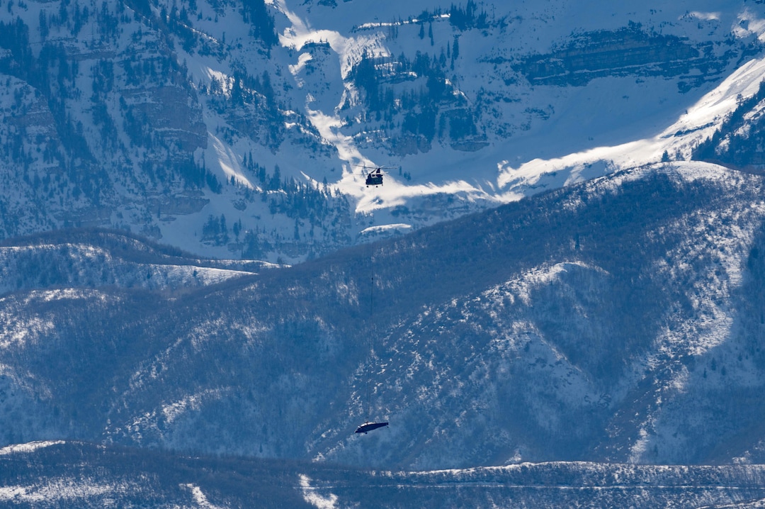 (Francisco Kjolseth | The Salt Lake Tribune) Recovery operations for two Utah Army National Guard UH-60 Black Hawk helicopters involved in a training accident in the Mineral Basin area last week are performed by a CH-47 Chinook helicopter and brought to the Heber Valley Airport on Wednesday, March 2, 2022.