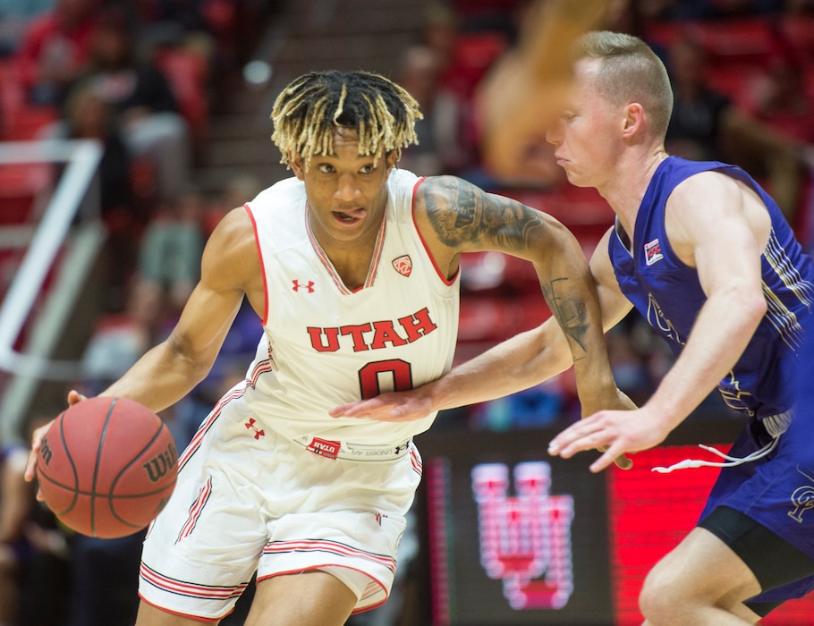 (Rick Egan  |  Tribune file photo) Utah Utes guard Naseem Gaskin (0) drives with the ball, as College of Idaho guard, Derek Wadsworth defends, in basketball action, between the Utah Utes and the College of Idaho Yotes at the Jon M. Huntsman Center, Thursday, Nov. 1, 2018.