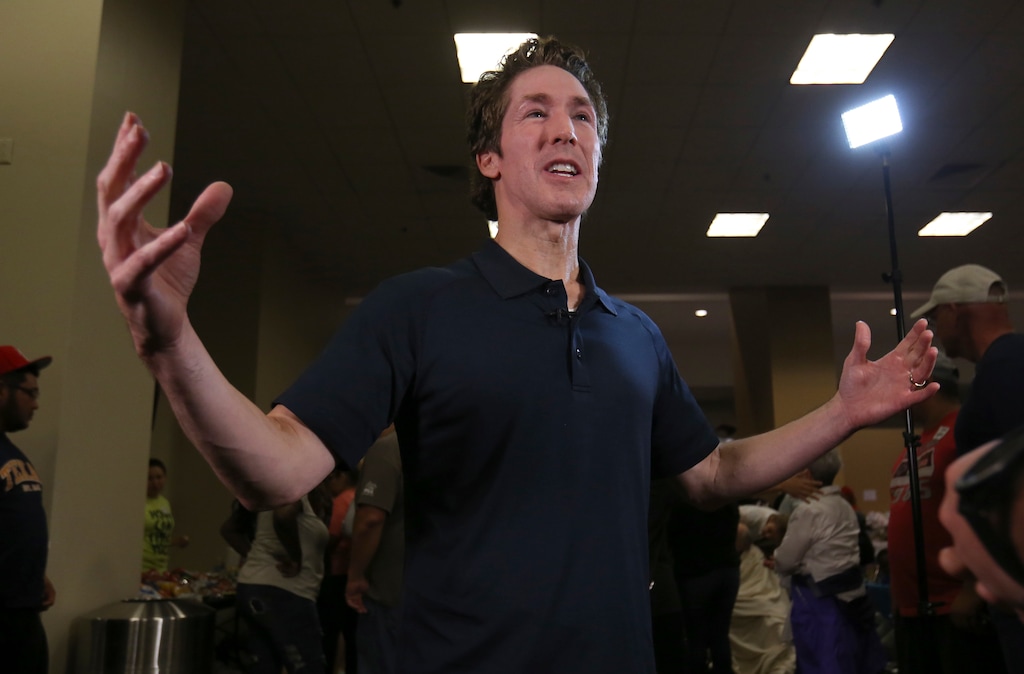 Pastor Joel Osteen gives an interview at his Lakewood Church in Houston, Texas, Tuesday, Aug. 29, 2017. Osteen and his congregation have set up their church as a shelter for evacuees from the flooding by Tropical Storm Harvey. (AP Photo/LM Otero)