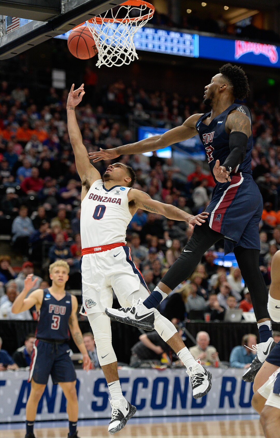 (Francisco Kjolseth  |  The Salt Lake Tribune)  Gonzaga Bulldogs guard Geno Crandall (0) is pressure on his way to the basket as Gonzaga faces Fairleigh Dickinson in their first round menÕs NCAA March Madness tournament game at Vivint Smart Home Arena in Salt Lake City on Thursday, March 21, 2019.
