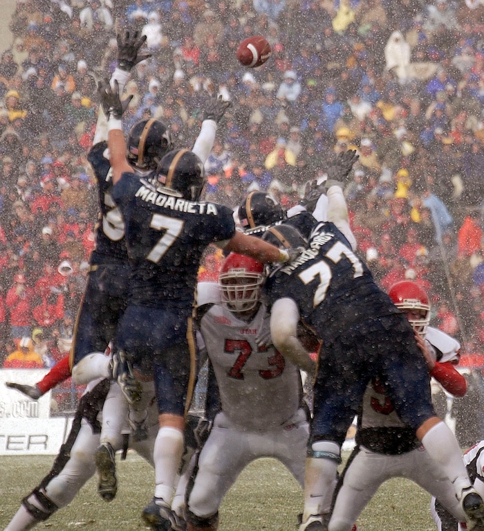 (Trent Nelson  |  Tribune file photo)  BYU defenders leap up, unsuccessfully attempting to block Utah's only score of the game. Utah won the game 3-0 on Saturday November 22, 2003 at LaVell Edwards Stadium.