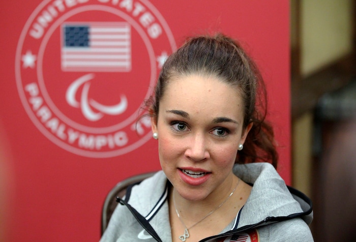 Ski-jumper Sarah Hendrickson speaks with reporters during a news conference at the U.S. Olympic Committee media summit Tuesday, Oct. 1, 2013, in Park City, Utah. (AP Photo/Rick Bowmer)