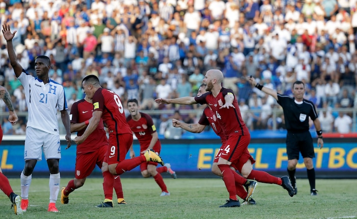 United States' Bobby Wood, 9, celebrates with teammates after scoring his team's first goal during a 2018 World Cup qualifying soccer match against Honduras in San Pedro Sula, Honduras, Tuesday, Sept. 5, 2017. (AP Photo/Rebecca Blackwell)