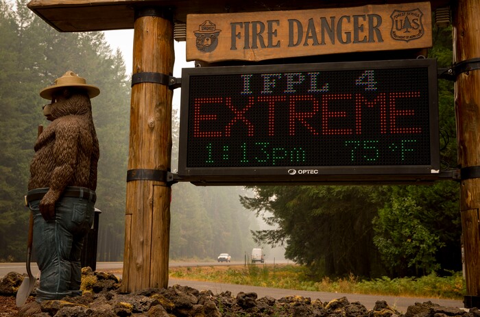 A sign board at the McKenzie River Ranger Station makes clear the fire danger level in the Willamette National Forest, Wednesday, Sept. 6, 2017 in Blue River, Ore. Several fires are burning in the area.(Andy Nelson/The Register-Guard via AP)