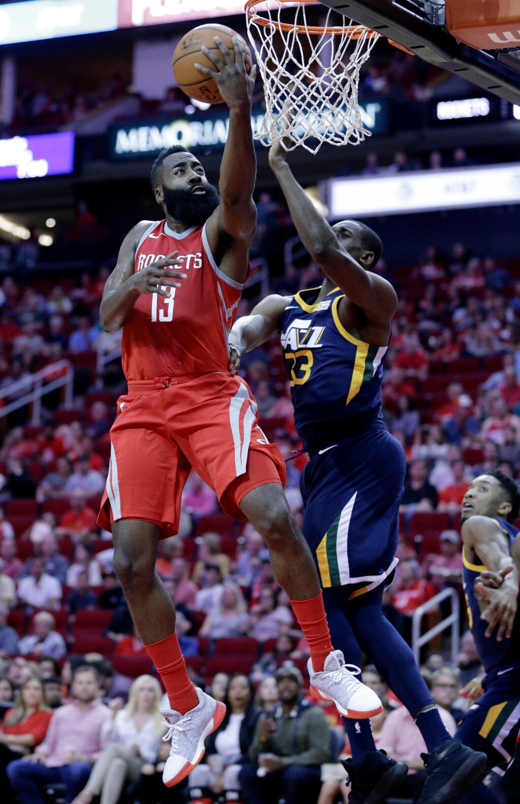Houston Rockets guard James Harden (13) lays up a shot past Utah Jazz center Ekpe Udoh (33) in the first half of an NBA basketball game Sunday, Nov. 5, 2017, in Houston. (AP Photo/Michael Wyke)