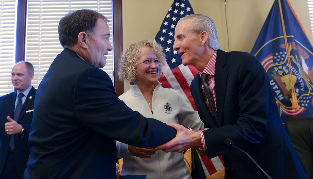 (Leah Hogsten | Tribune file photo) l-r Gov. Gary R. Herbert, Salt Lake City Mayor Jackie Biskupski and Senate President Wayne Niederhauser celebrate with members of the Olympic/Paralympic Exploratory Committee after signing SCR9. The Salt Lake Olympic Exploratory Committee voted on Feb. 7, 2018, to recommend that Utah should pursue hosting the Olympic and Paralympic Winter Games in 2030.