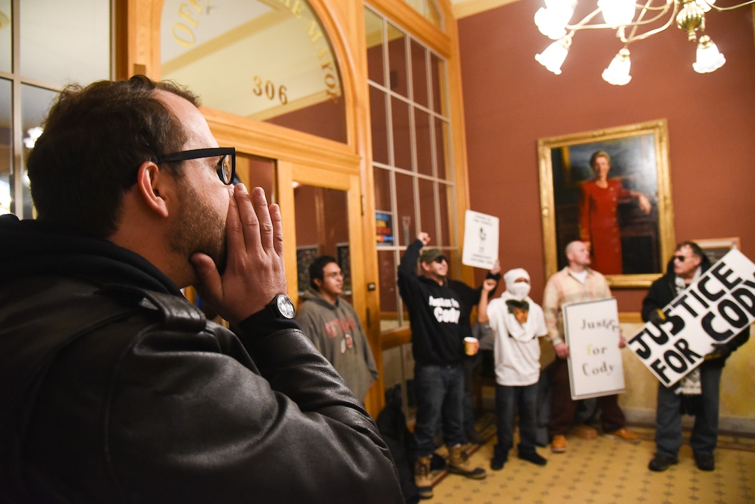 (Francisco Kjolseth  |  The Salt Lake Tribune)  David Newlin with Utah Against Police Brutality and members of Cody BelgardÕs family, the popular Glendale rapper, who was shot by police last November, park themselves at the office of Mayor Jackie Biskupski as they try to appeal to the staff for a meeting with the mayor. For weeks, the family of Cody Belgard has asked to meet with Mayor Biskupski to discuss his shooting by SLCPD, to no avail.