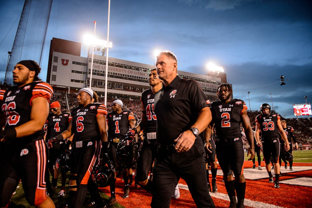 (Trent Nelson | The Salt Lake Tribune)  Utah Utes head coach Kyle Whittingham leads his team to the locker room before the game as the University of Utah hosts Washington at Rice-Eccles Stadium in Salt Lake City, Saturday Sept. 15, 2018.