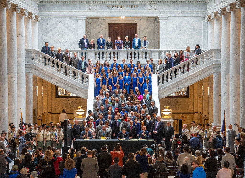 (Rick Egan  |  The Salt Lake Tribune)  Surrounded by supporters, Gov. Gary R. Herbert signs into law the new hate crimes bill along with Senate President Stuart Adams, Sen. Daniel Thatcher, Rep. Lee Perry and Lt Gov. Spencer Cox, at the Utah State Capitol, Tuesday, April 2, 2019.
