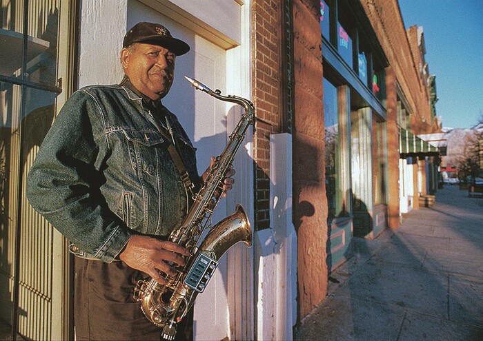 Steve Griffin | Tribune file photo
Joe McQueen, seen here in 1997 on Ogden's 25th Street. A saxophonist in Ogden’s jazz scene, McQueen used his music to desegregate the city’s night clubs. McQueen died Dec. 7, 2019, at age 100.