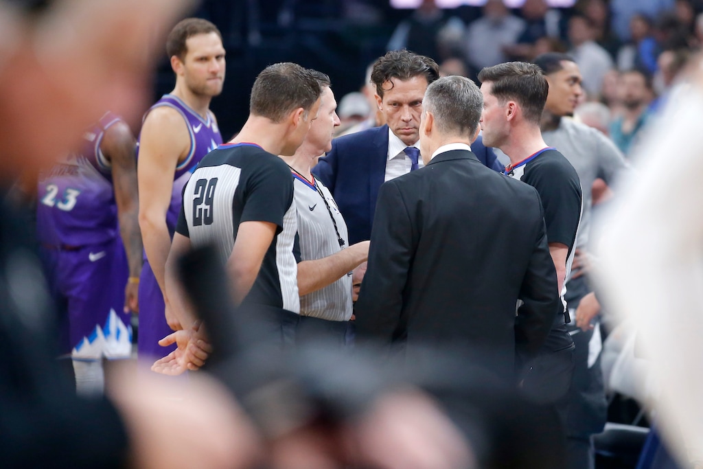 (Bryan Terry | The Oklahoman via AP) Utah Jazz coach Quin Snyder meets with Oklahoma City coach Billy Donovan and officials before an NBA basketball game was postponed in Oklahoma City, Wednesday, March 11, 2020.