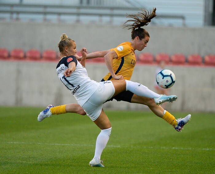 (Francisco Kjolseth  |  The Salt Lake Tribune)  North Carolina Courage defender Merritt Mathias (11) battles Utah Royals FC defender Kelley O'Hara (5) for possession as Utah Royals FC hosts the North Carolina Courage at Rio Tinto Stadium in Sandy, Utah on Saturday, July 27, 2019.