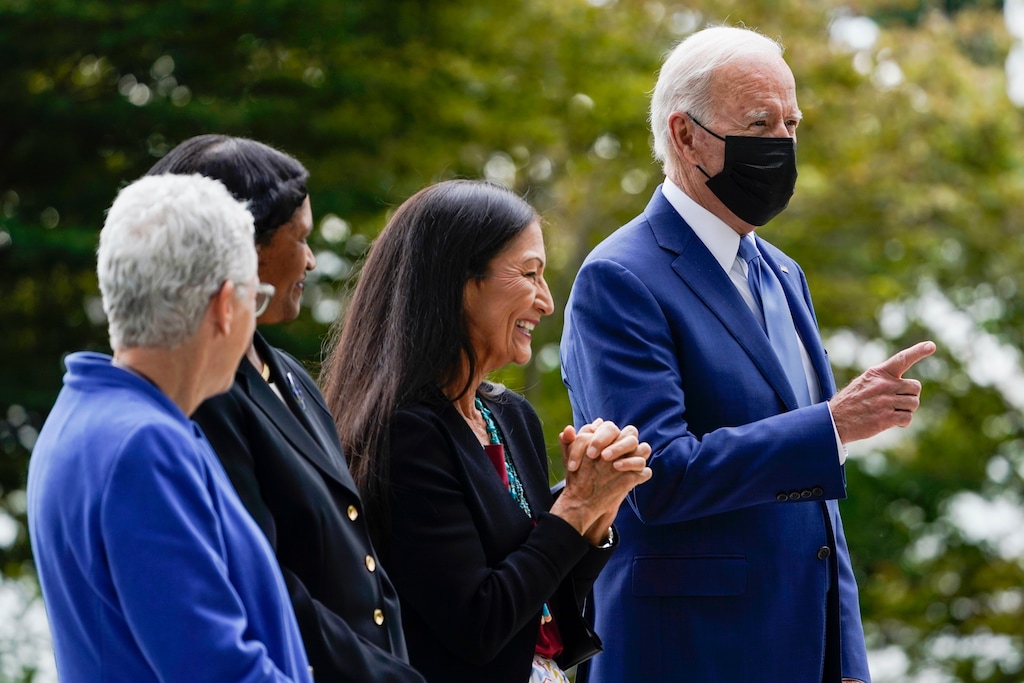 (Susan Walsh | The Associated Press) President Joe Biden is photographed on the North Lawn of the White House in Washington, Friday, Oct. 8, 2021, with White House national climate adviser Gina McCarthy, Brenda Mallory, chair of the council on environmental quality, and Interior Secretary Deb Haaland during an event announcing that his administration is restoring protections for two sprawling national monuments in Utah that have been at the center of a long-running public lands dispute.
