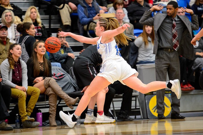 (Trent Nelson | The Salt Lake Tribune)  Bingham's Maggie McCord (15) chases a loose ball onto the Northridge bench as Bingham faces Northridge in the 6A High School Girls' Basketball Tournament at SLCC in Taylorsville, Thursday Feb. 22, 2018.