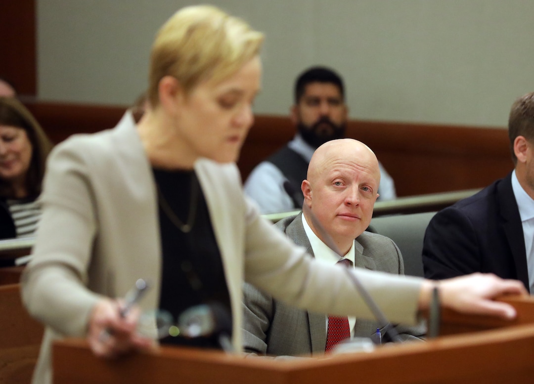 Robert P. Harrington, who represents Republican U.S. Rep. Mia Love's lawsuit, looks on as Deputy Salt Lake County attorney Bridget K. Romano, speaks in Third District Court Thursday Nov. 15, 2018, in West Jordan, Utah. A Utah judge has reserved a decision on a lawsuit in a tight House race filed by a Republican incumbent who is seeking to halt vote counting in a Democratic-leaning county that's key to the outcome. Judge James Gardner heard arguments Thursday in the lawsuit filed by U.S. Rep Mia Love, but ended the hearing without making a ruling. (AP Photo/Rick Bowmer, Pool)