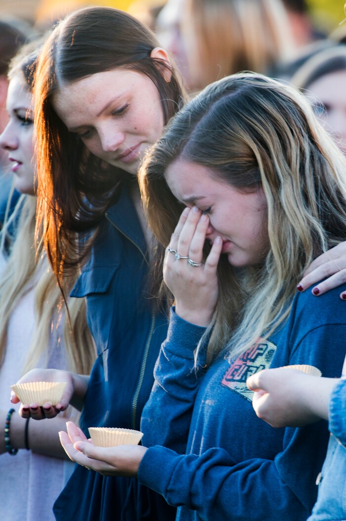 (Rick Egan  |  The Salt Lake Tribune)  Southern Utah University student Taylor Heath (left) comforts Hayley Goen (right) during a candle light vigil for the victims of the Las Vegas shooting, on the SUU campus in Cedar City, Wednesday, October 4, 2017.