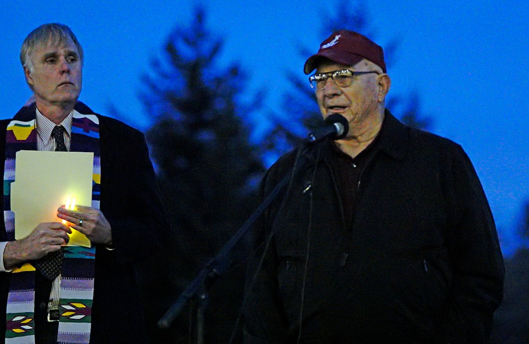 (Kai Eiselein  |  The Moscow-Pullman Daily News via AP)  With pastor Steve Van Kuiken looking on, Ross Rudeen talks about his granddaughter Lauren McCluskey during a vigil for her at the Pullman High School track Wednesday, Oct. 24, 2018, in Pullman, Wash. Police said Melvin Rowland, 37, fatally shot 21-year-old McCluskey of Pullman, Wash., on Monday night on the university campus and then killed himself in a church as officers closed in.
