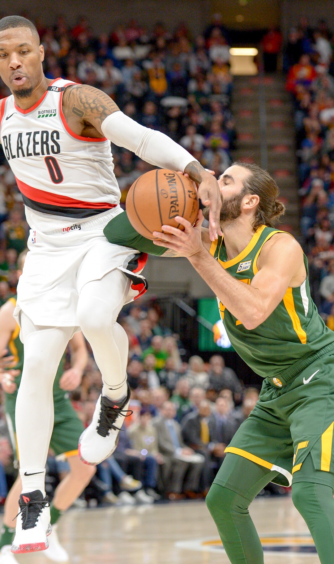 Leah Hogsten  |  The Salt Lake Tribune  Portland Trail Blazers guard Damian Lillard (0) tries to steal Utah Jazz guard Ricky Rubio (3). The Utah Jazz defeated the Portland Trail Blazers, 117-96, Christmas night at Vivint Smart Home Arena.